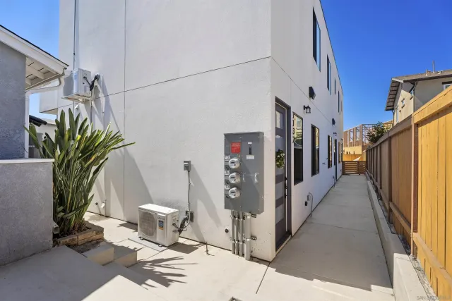 a view of a kitchen with a sink and refrigerator