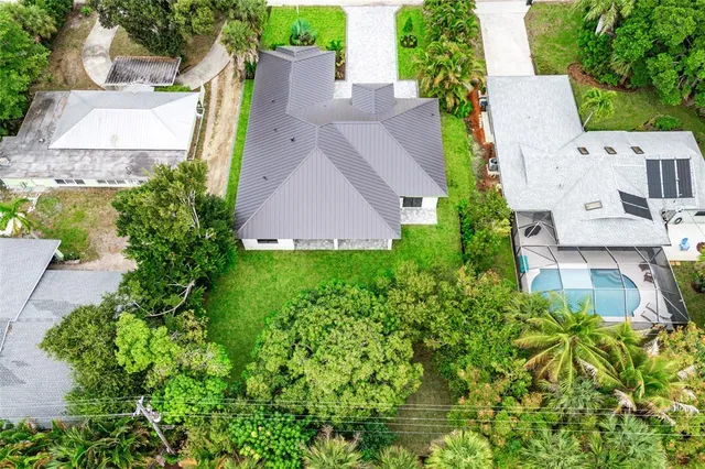 an aerial view of residential houses with outdoor space
