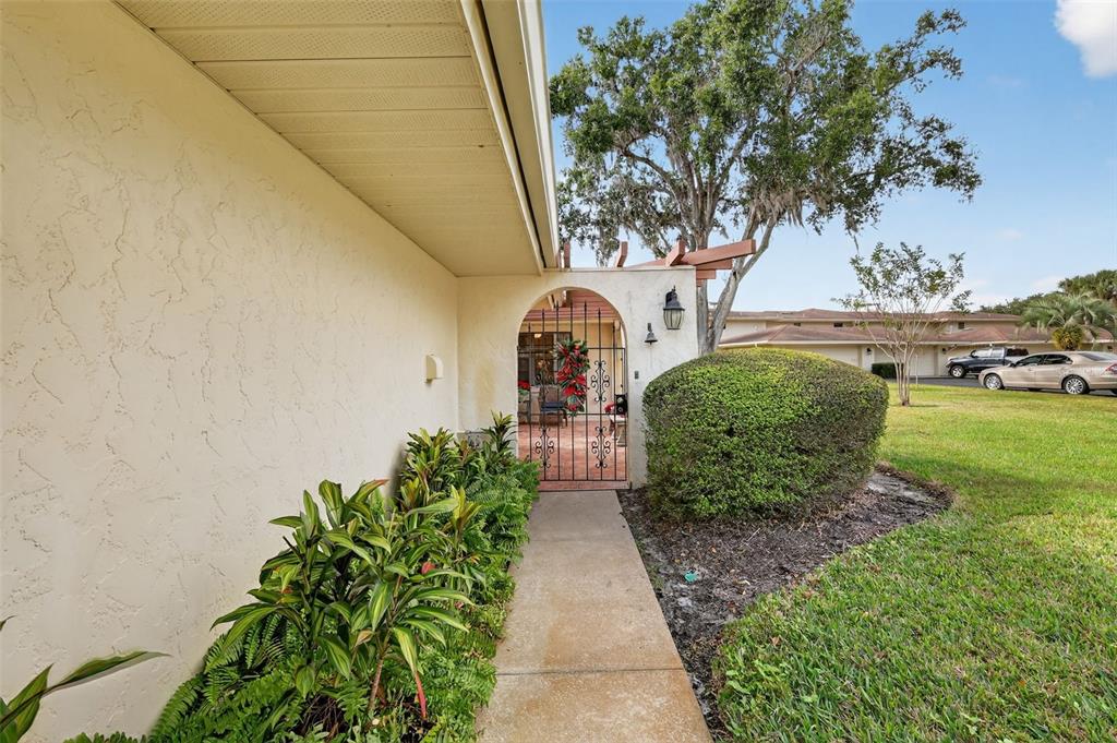 100 South Tremain Street, Unit F1 Mount Dora, FL 32757 - Photo 2 of 47 a view of a garden