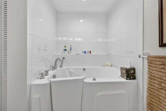 a utility room with a sink washer and dryer