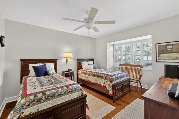 a bedroom with a large bed and a couch