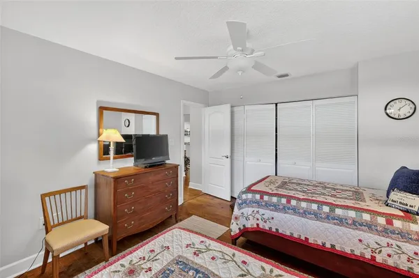 a bedroom with a bed and dresser