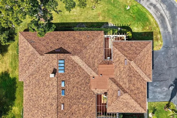 aerial view of a house with a yard