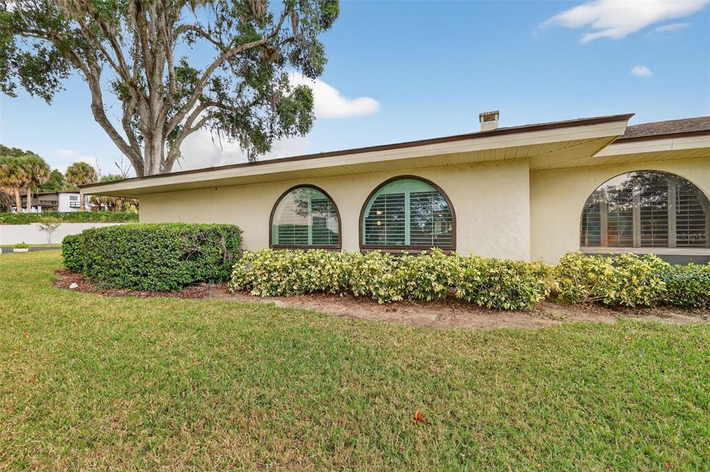 100 South Tremain Street, Unit F1 Mount Dora, FL 32757 - Photo 34 of 47 a front view of a house with garden
