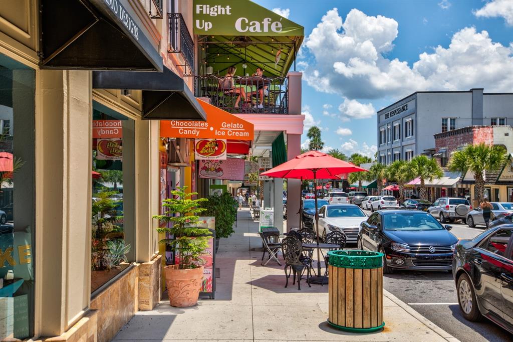 100 South Tremain Street, Unit F1 Mount Dora, FL 32757 - Photo 38 of 47 a view of a chairs and tables in a patio