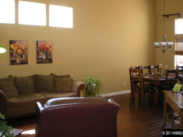 9779 Thunder Mountain Way Reno, NV 89521 - Photo 8 of 12 a living room with furniture and wooden floor