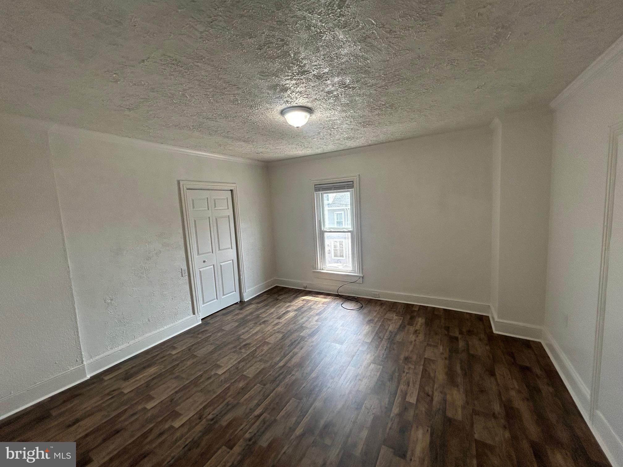 402 North 4th Street, Unit 3 Lebanon, PA 17046 - Photo 1 of 6 wooden floor in an empty room with a window