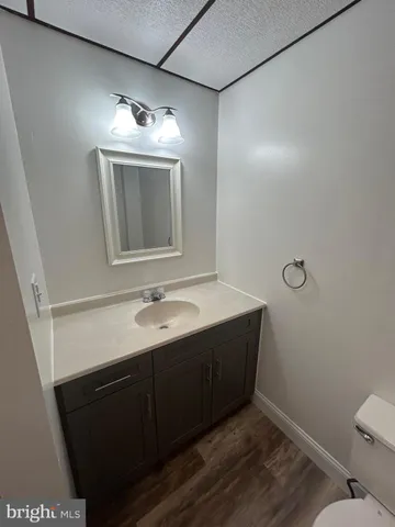 a bathroom with a sink vanity and a mirror