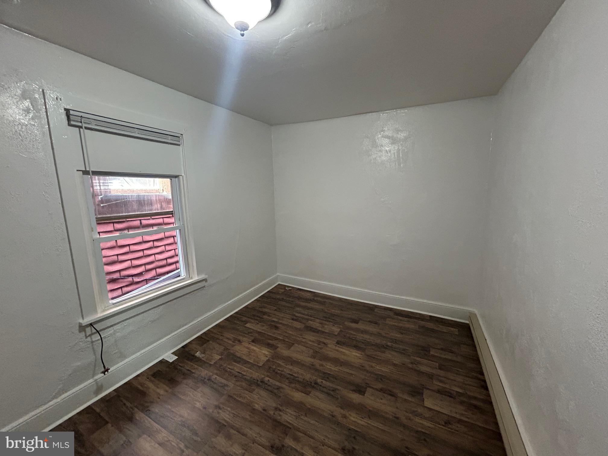 402 North 4th Street, Unit 3 Lebanon, PA 17046 - Photo 4 of 6 a view of a hallway with wooden floor and a window
