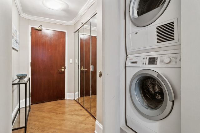 a view of a hallway with washer and dryer