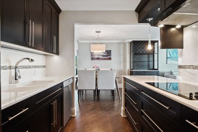 a kitchen with counter top space cabinets and stainless steel appliances