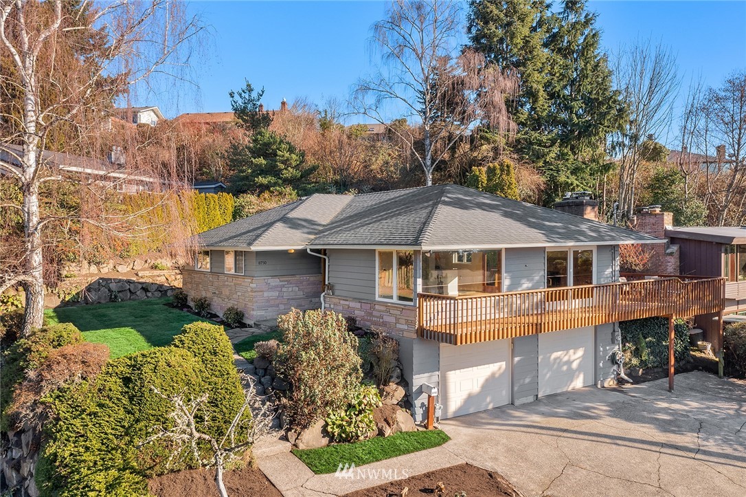 8750 Fauntlee Crest Southwest Seattle, WA 98136 - Photo 1 of 40 a front view of a house with a yard