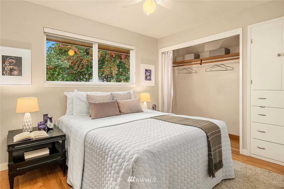 8750 Fauntlee Crest Southwest Seattle, WA 98136 - Photo 21 of 40 a bedroom with a bed and a window