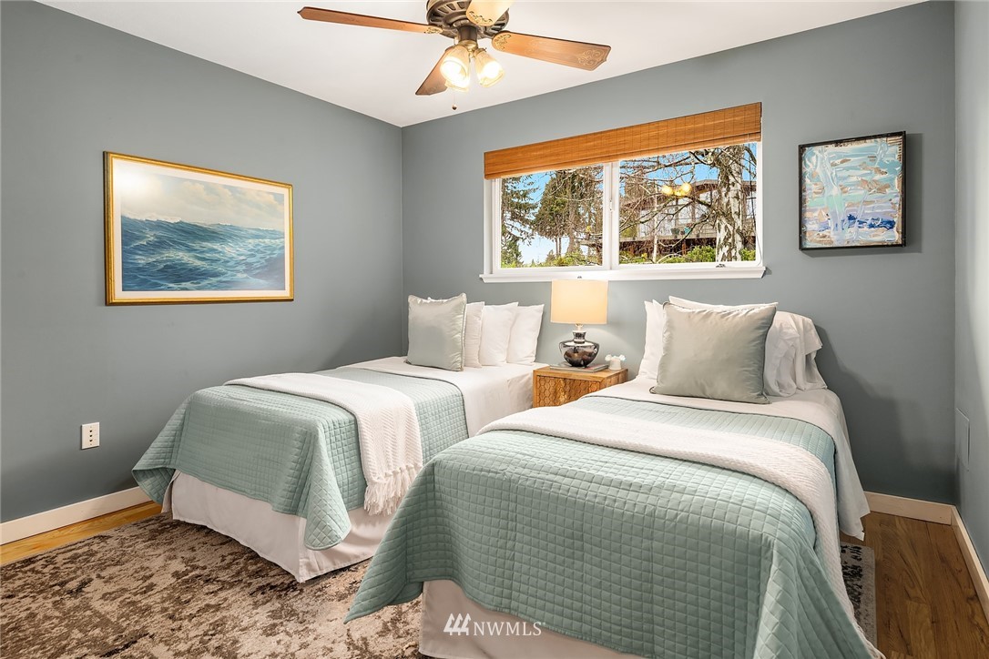 8750 Fauntlee Crest Southwest Seattle, WA 98136 - Photo 22 of 40 a bedroom with two beds and a window