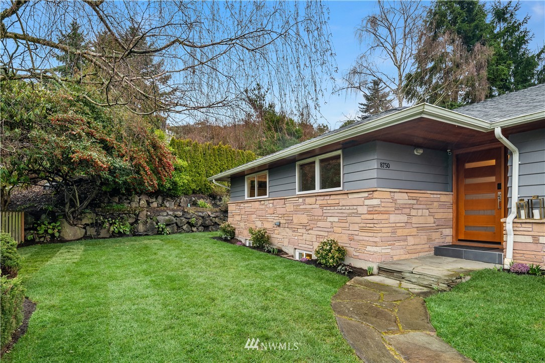 8750 Fauntlee Crest Southwest Seattle, WA 98136 - Photo 28 of 40 a front view of house with yard and green space