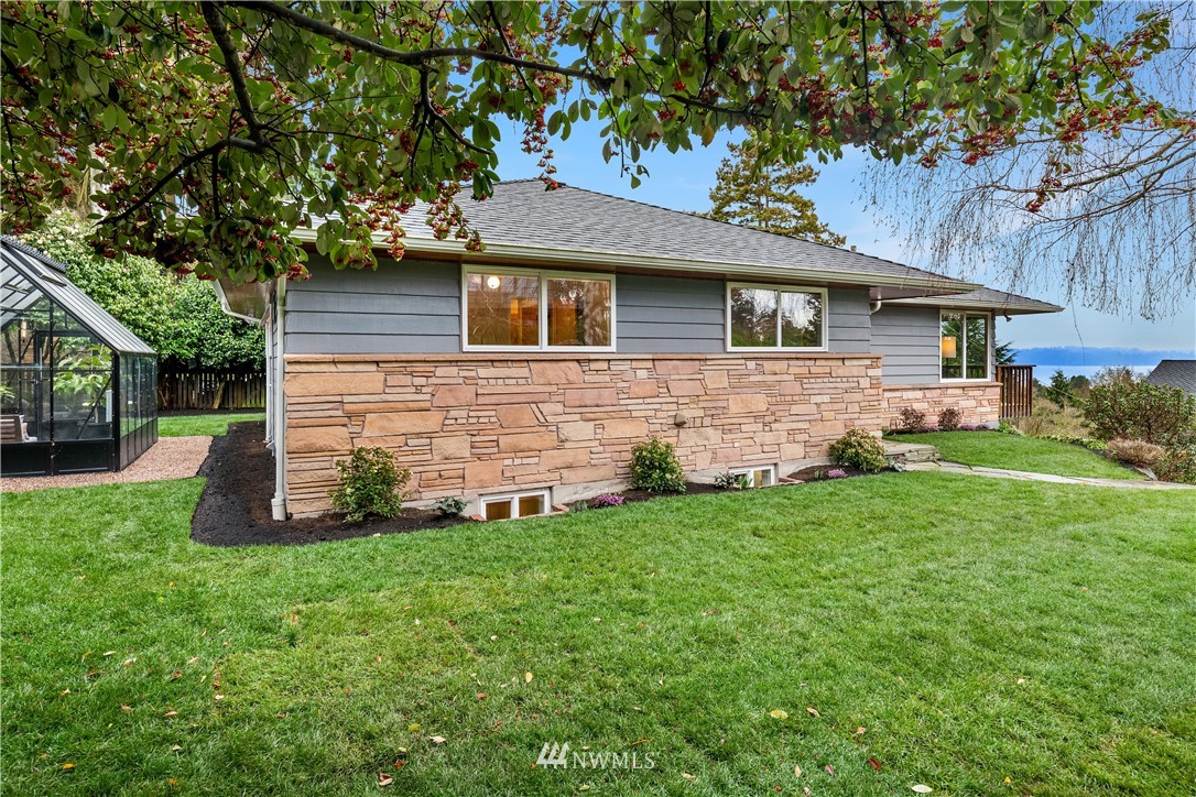 8750 Fauntlee Crest Southwest Seattle, WA 98136 - Photo 29 of 40 a front view of house with yard and green space