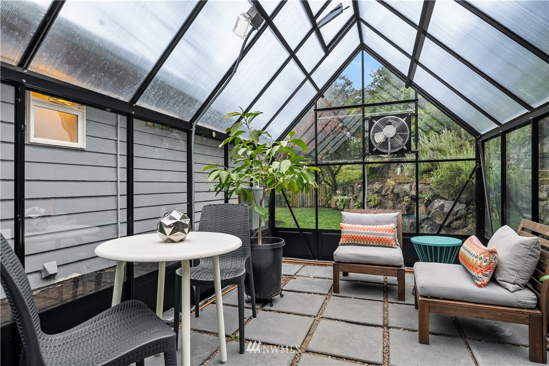 8750 Fauntlee Crest Southwest Seattle, WA 98136 - Photo 31 of 40 a outdoor space with the couches and dining table