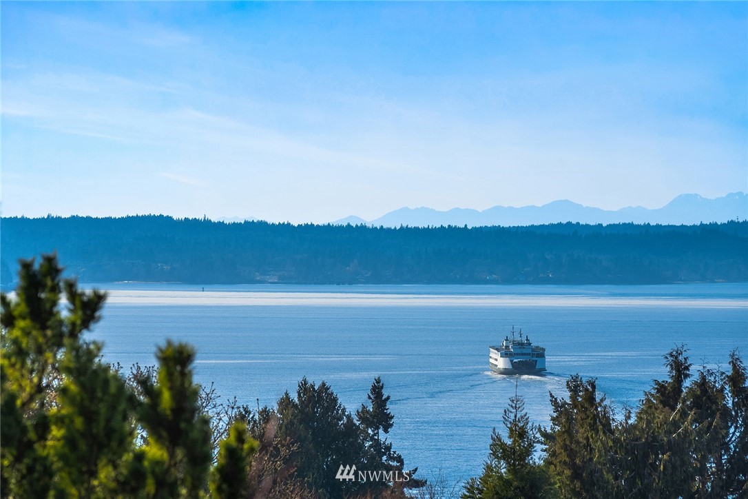 8750 Fauntlee Crest Southwest Seattle, WA 98136 - Photo 35 of 40 a view of ocean with sunset