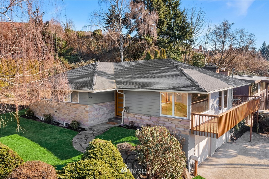 8750 Fauntlee Crest Southwest Seattle, WA 98136 - Photo 40 of 40 a front view of a house with garden
