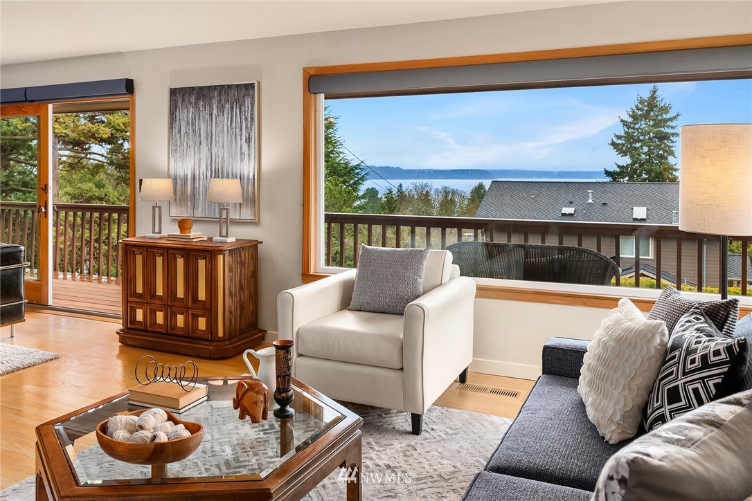8750 Fauntlee Crest Southwest Seattle, WA 98136 - Photo 6 of 40 a living room with furniture and a floor to ceiling window