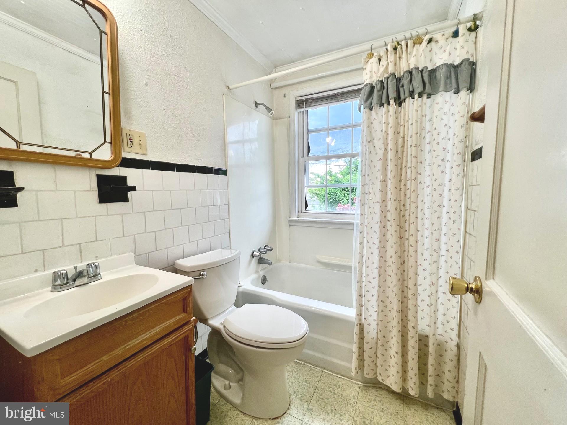 2801 Southbrook Road Baltimore, MD 21222 - Photo 11 of 26 a bathroom with a sink toilet and shower