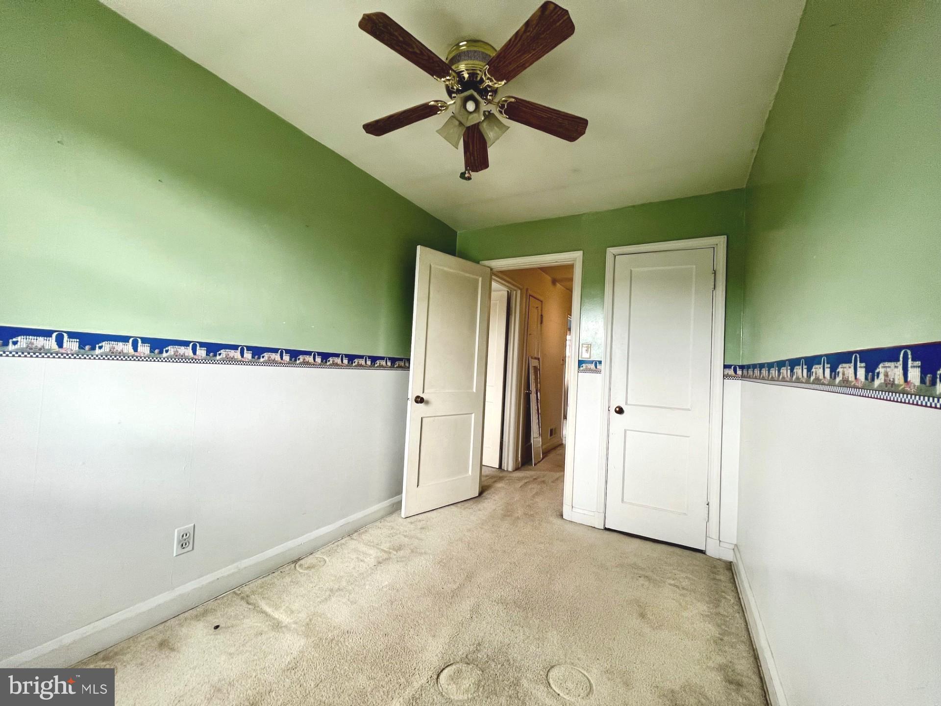2801 Southbrook Road Baltimore, MD 21222 - Photo 14 of 26 a view of a livingroom with a ceiling fan and window