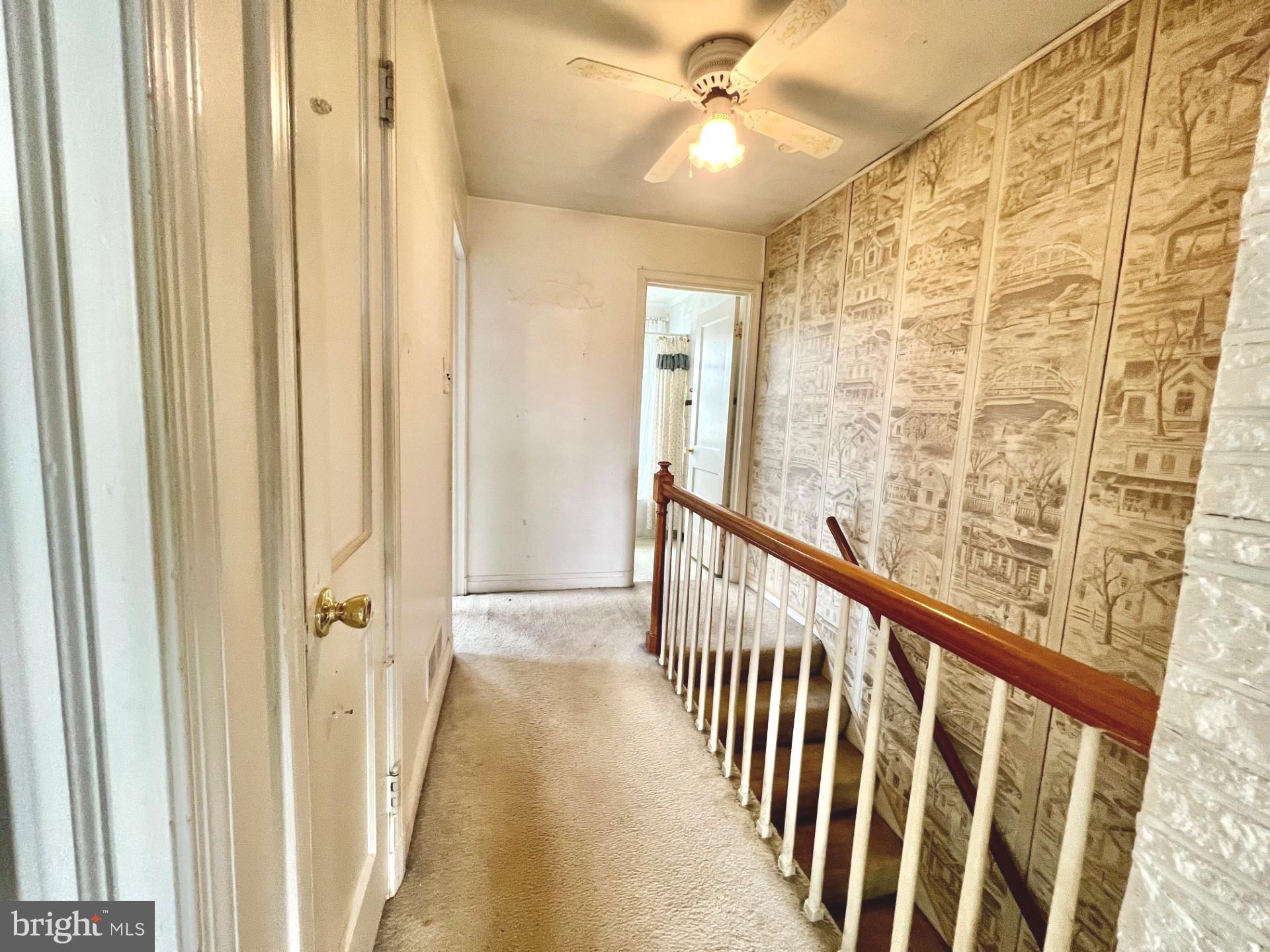 2801 Southbrook Road Baltimore, MD 21222 - Photo 17 of 26 a view of a hallway with wooden floor and staircase