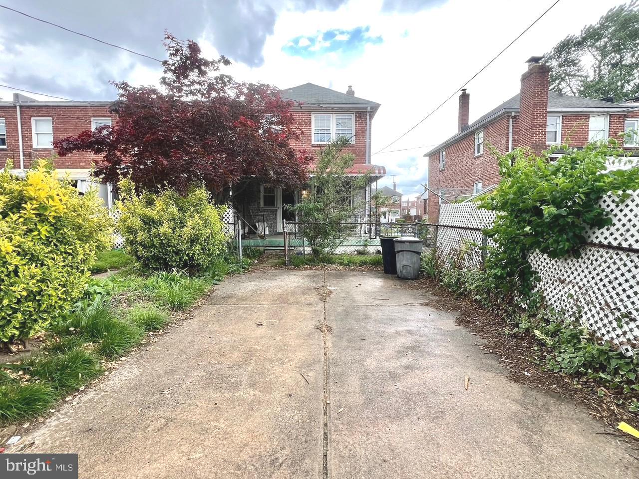 2801 Southbrook Road Baltimore, MD 21222 - Photo 24 of 26 a view of a brick house with a yard and plants