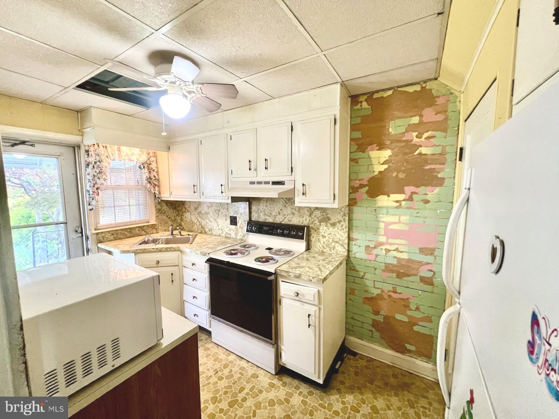 2801 Southbrook Road Baltimore, MD 21222 - Photo 5 of 26 a kitchen with stainless steel appliances granite countertop a sink stove and refrigerator