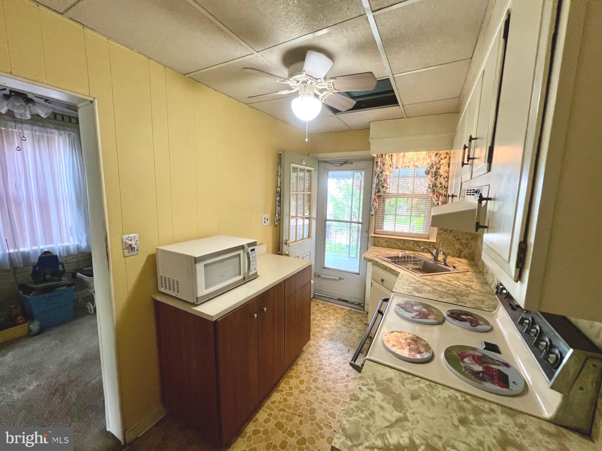 2801 Southbrook Road Baltimore, MD 21222 - Photo 6 of 26 a kitchen with stainless steel appliances granite countertop a sink stove and refrigerator