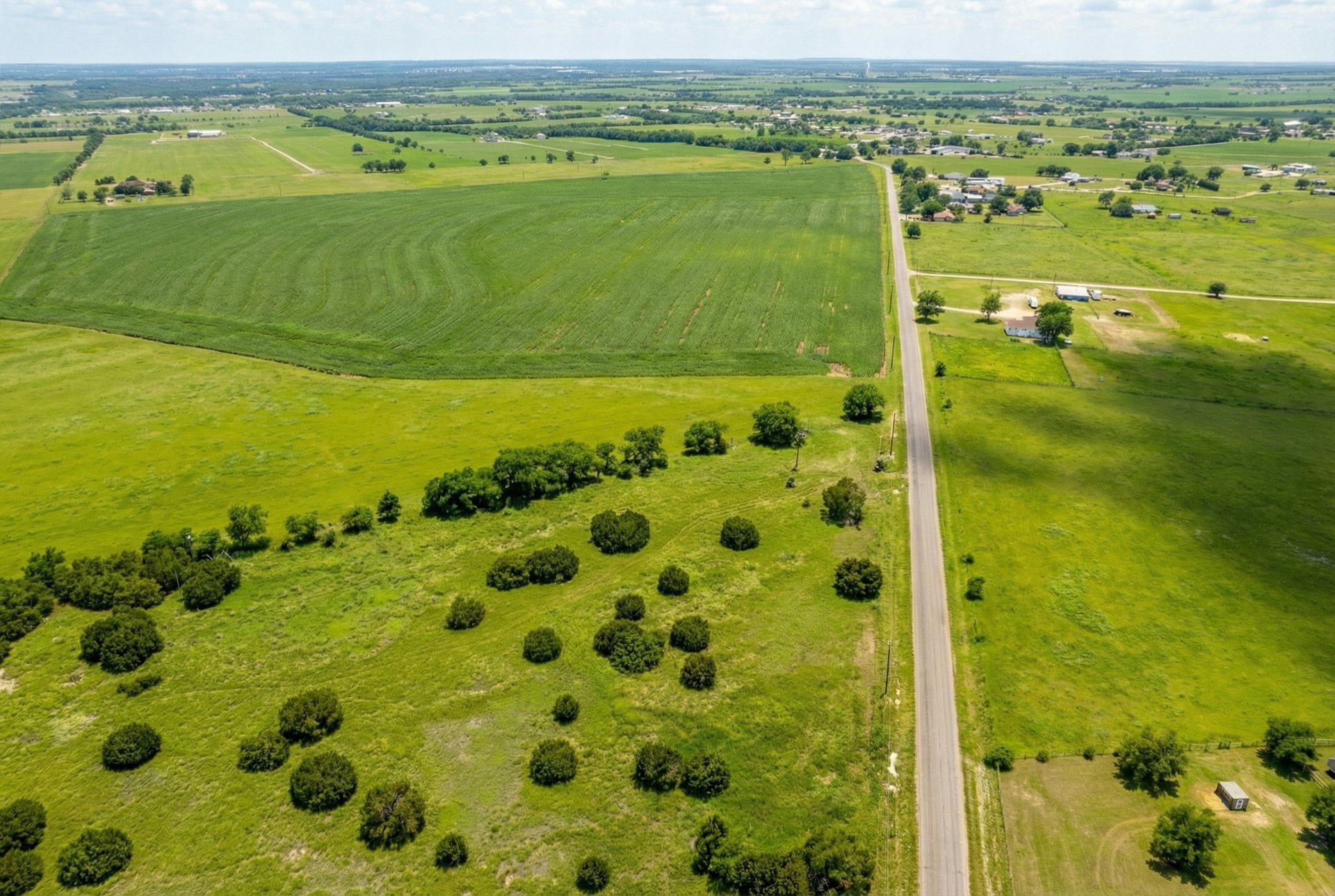 562 County Road 154 Georgetown, TX 78626 - Photo 4 of 13 Aerial view of sparsely populated area featuring agricultural land
