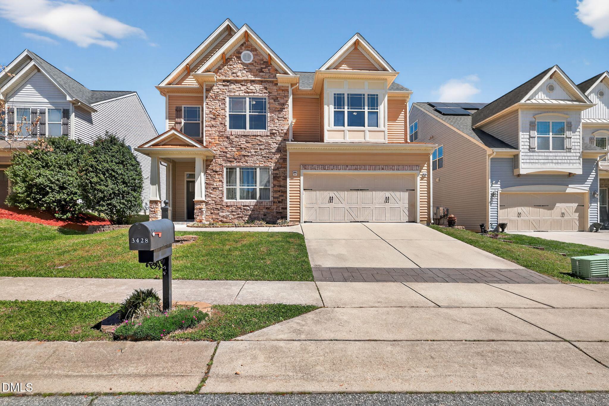 3428 Massey Pond Trail Raleigh, NC 27616 - Photo 1 of 39 a front view of a house with a yard and potted plants