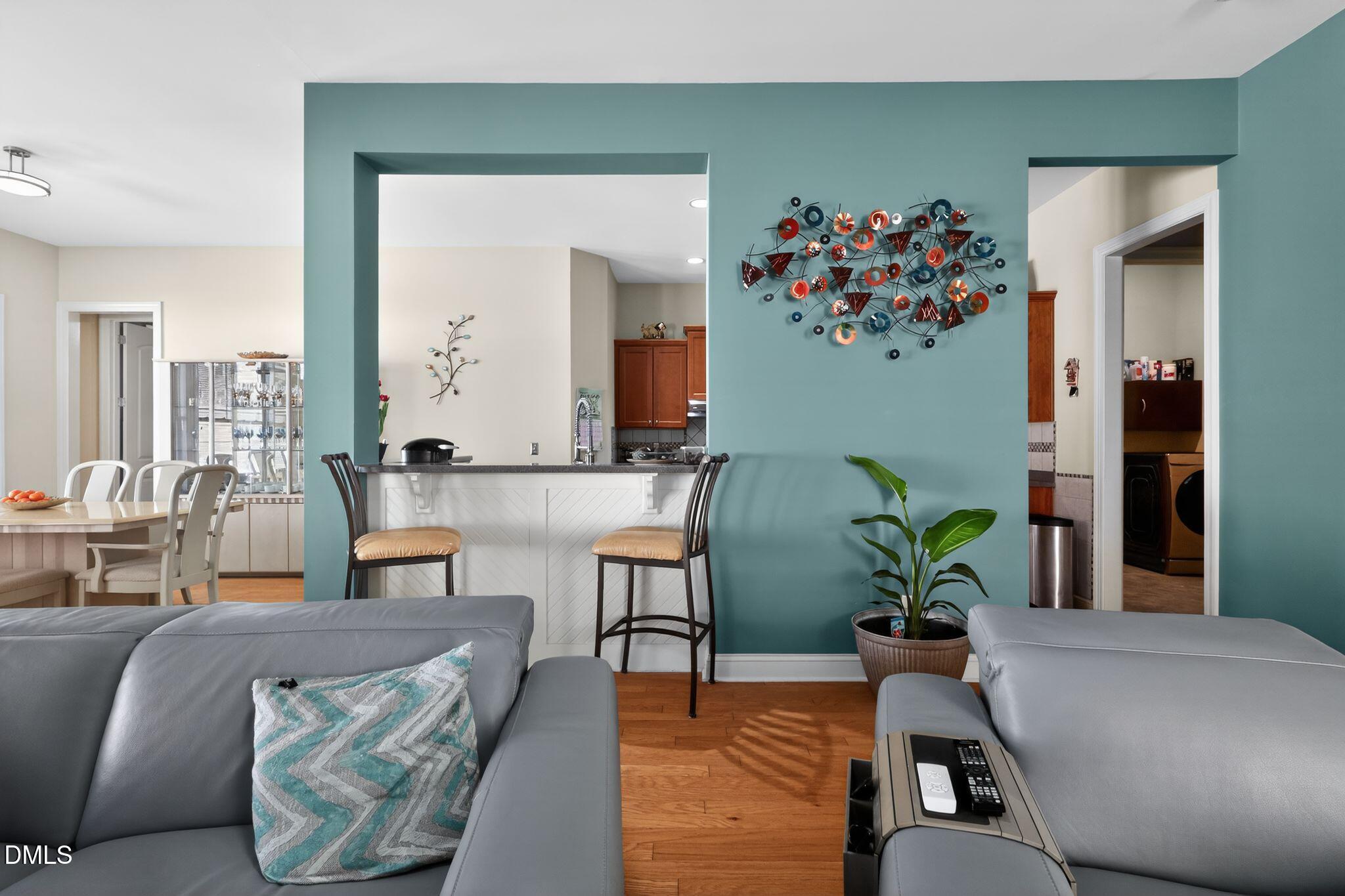 3428 Massey Pond Trail Raleigh, NC 27616 - Photo 8 of 39 a living room with furniture and flowers