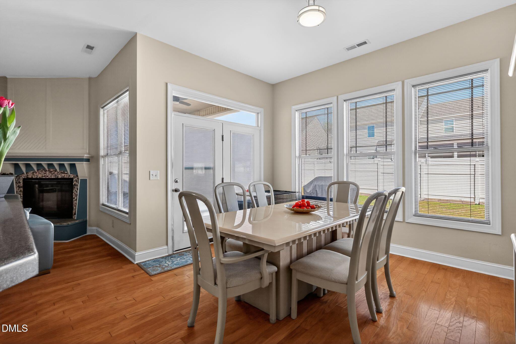 3428 Massey Pond Trail Raleigh, NC 27616 - Photo 11 of 39 a view of a dining room with furniture and wooden floor