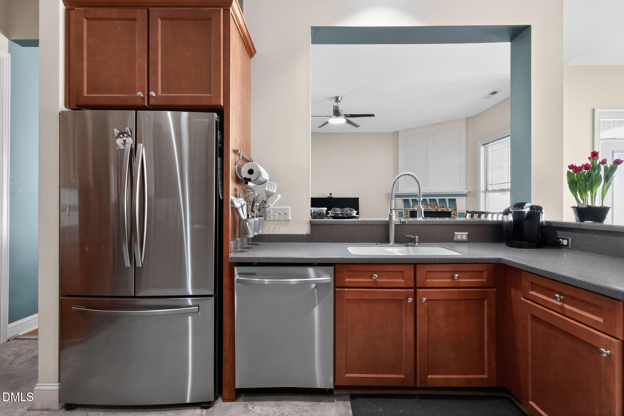 3428 Massey Pond Trail Raleigh, NC 27616 - Photo 12 of 39 a kitchen with stainless steel appliances granite countertop a refrigerator sink and cabinets