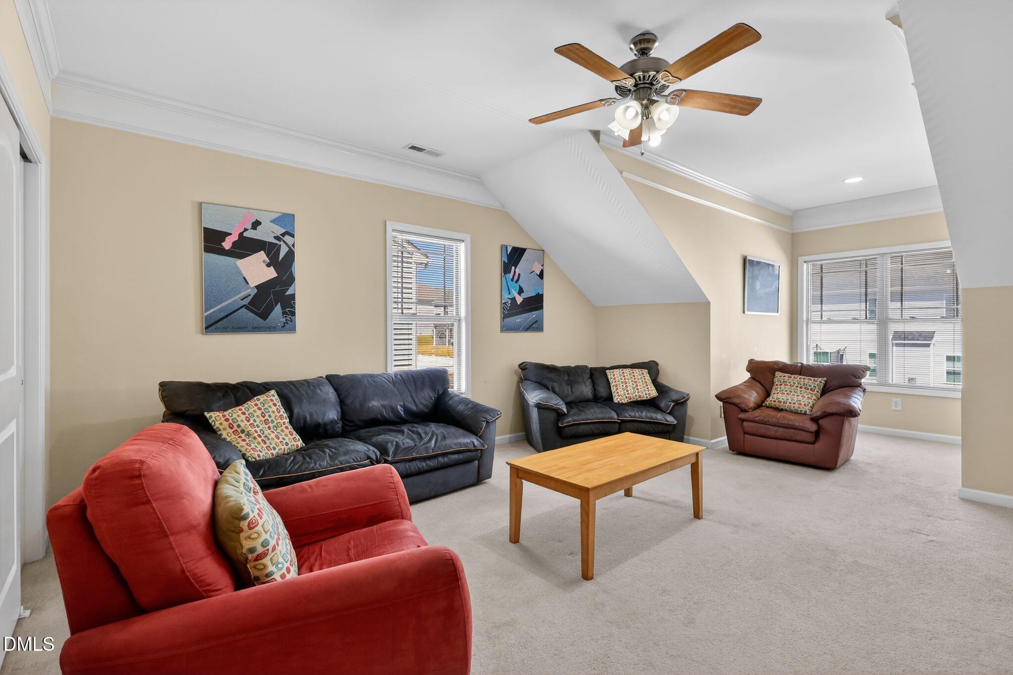 3428 Massey Pond Trail Raleigh, NC 27616 - Photo 23 of 39 a living room with furniture and a chandelier