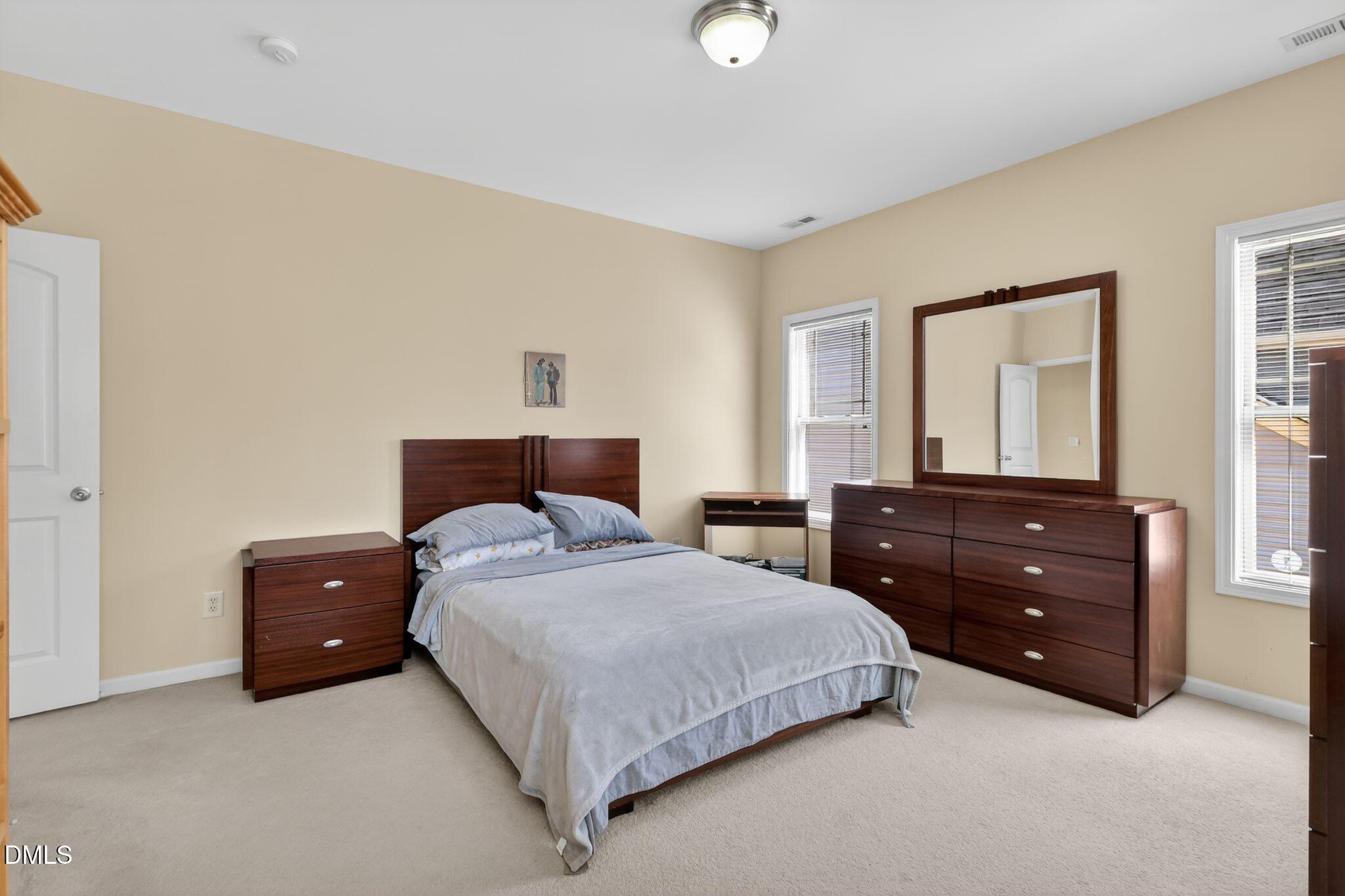 3428 Massey Pond Trail Raleigh, NC 27616 - Photo 27 of 39 a bedroom with a bed and a dresser