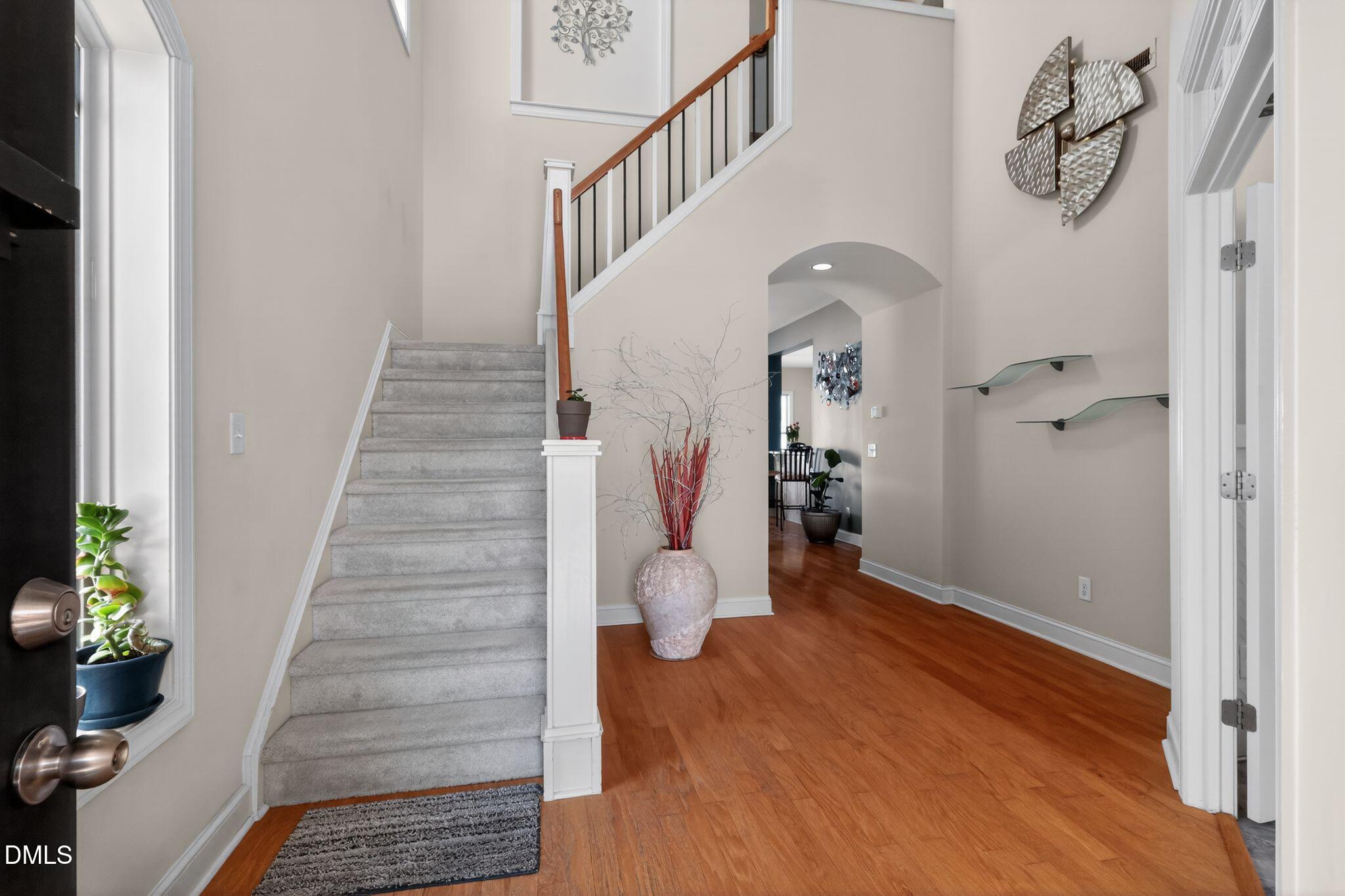 3428 Massey Pond Trail Raleigh, NC 27616 - Photo 3 of 39 a view of entryway and hall with wooden floor