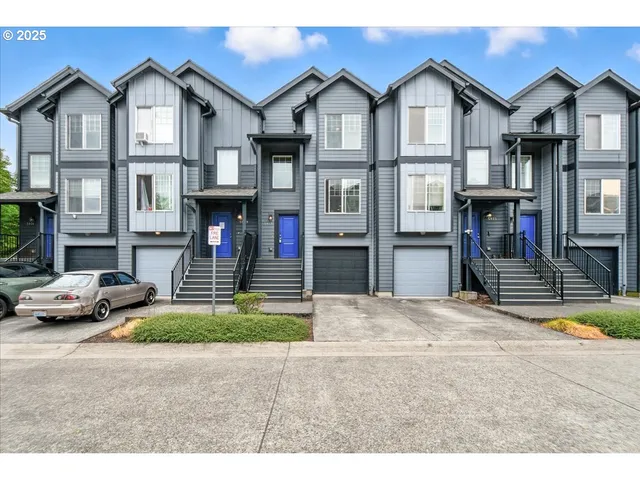 a front view of a houses on the street