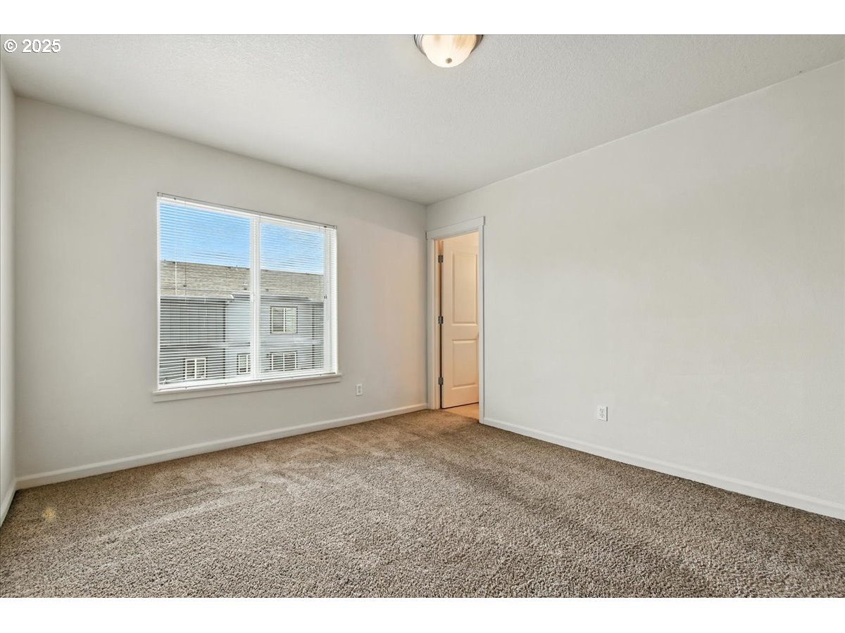 5927 Northeast 34th Street Vancouver, WA 98661 - Photo 18 of 29 a view of an empty room with a window