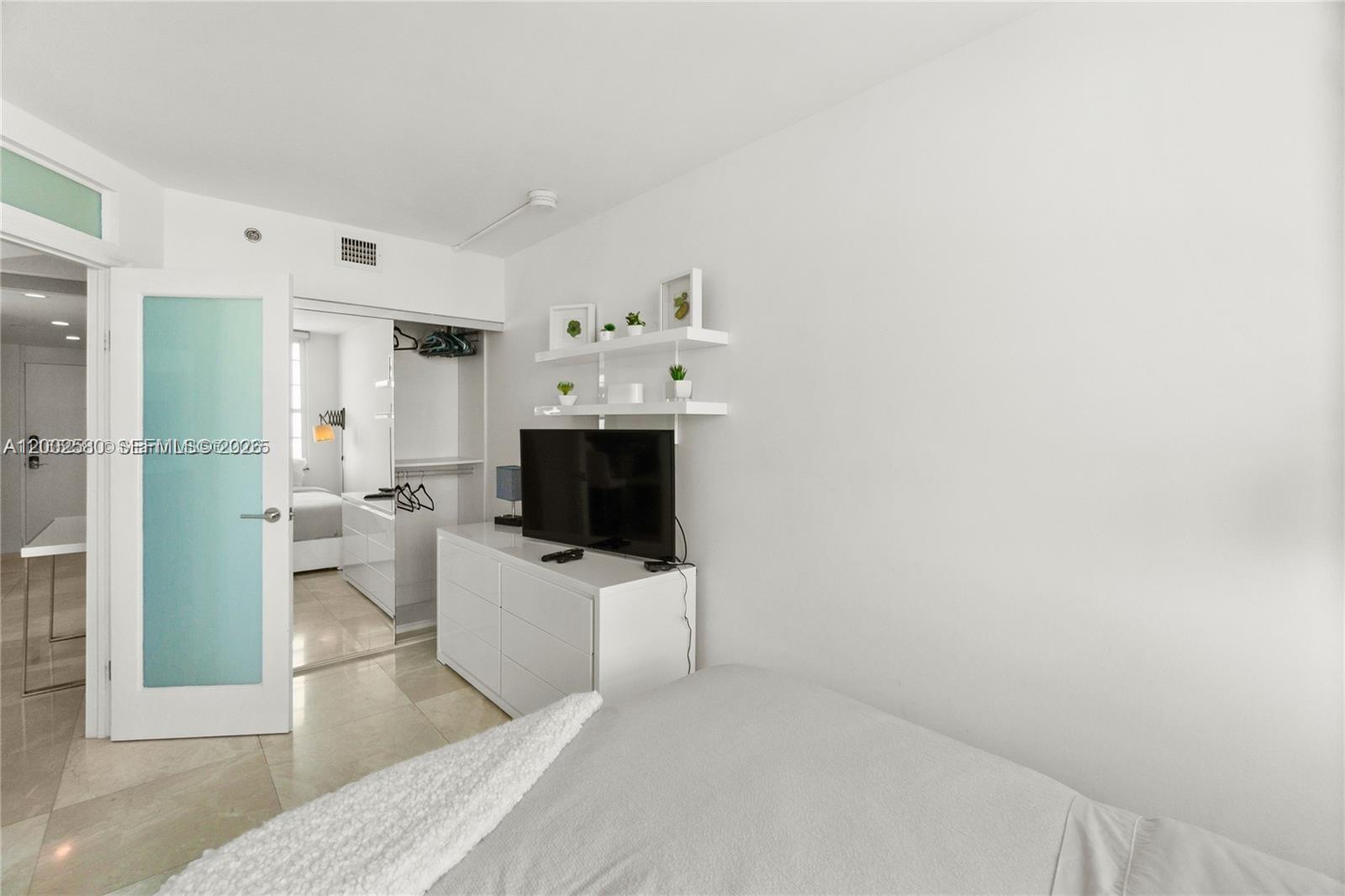 100 Lincoln Road, Unit 1046 Miami Beach, FL 33139 - Photo 13 of 18 a living room with furniture and a flat screen tv