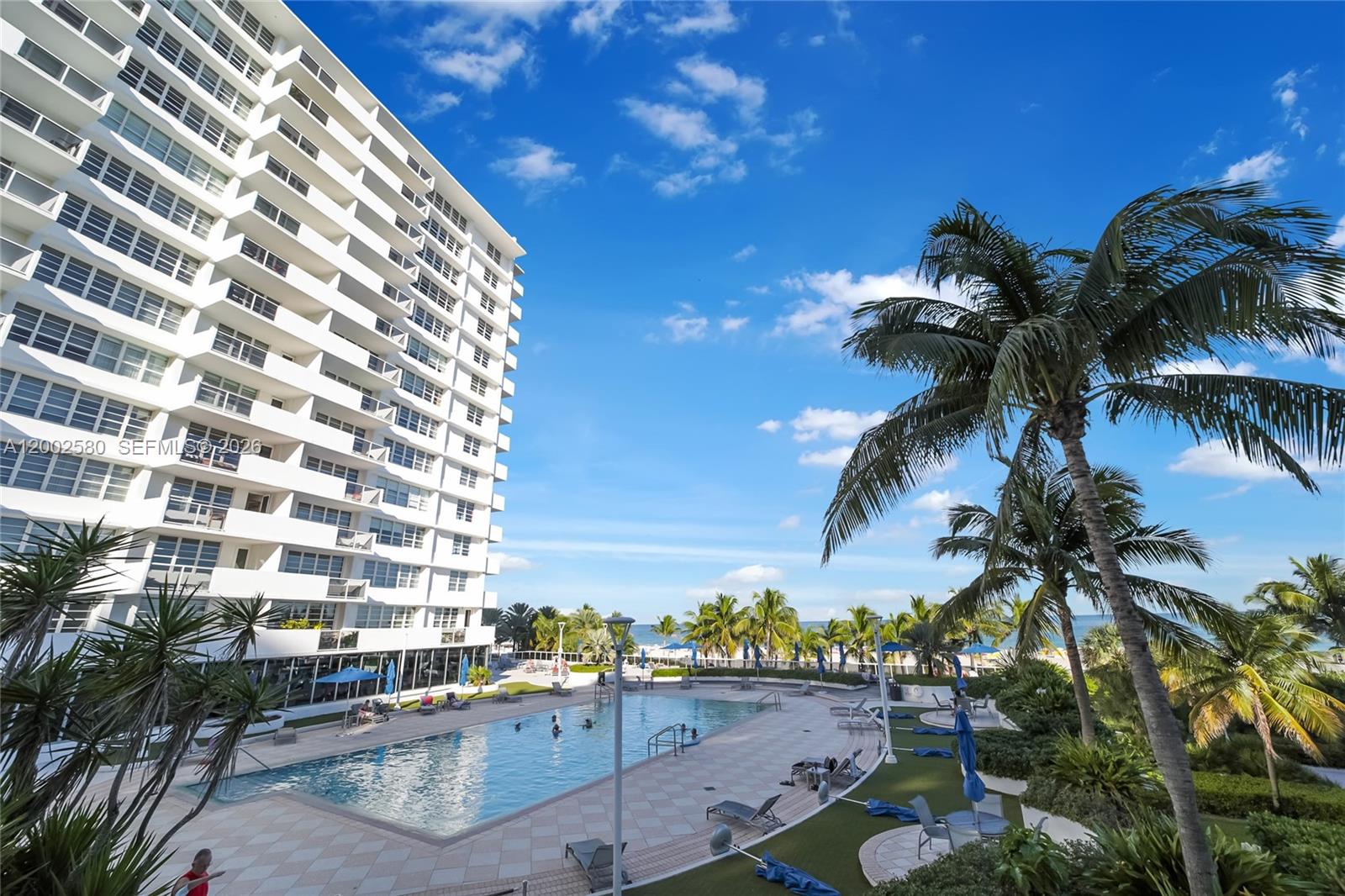 100 Lincoln Road, Unit 1046 Miami Beach, FL 33139 - Photo 16 of 18 a view of a tall building with a palm tree