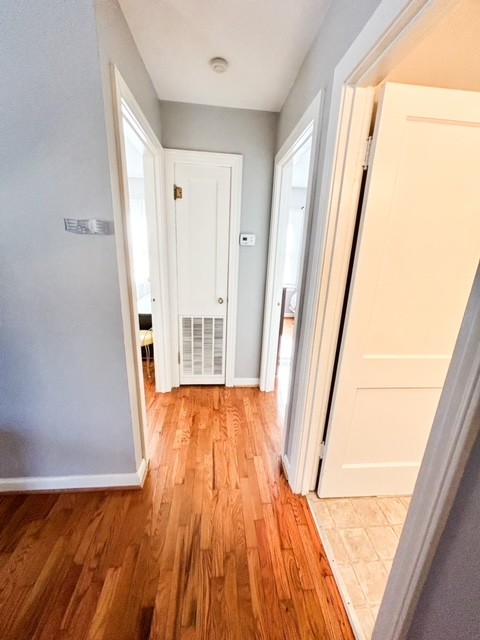 203 Glenhaven Road Paris, TN 38242 - Photo 11 of 42 a view of a hallway with wooden floor and staircase