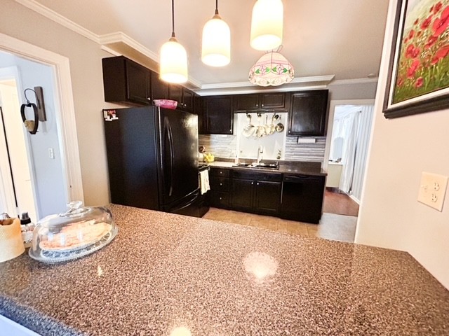 203 Glenhaven Road Paris, TN 38242 - Photo 12 of 42 a kitchen with stainless steel appliances granite countertop a sink a stove and a refrigerator