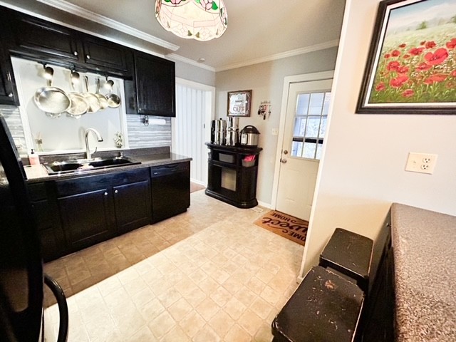 203 Glenhaven Road Paris, TN 38242 - Photo 13 of 42 a kitchen with a sink appliances and cabinets