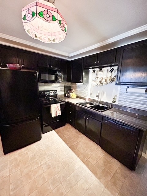 203 Glenhaven Road Paris, TN 38242 - Photo 15 of 42 a kitchen with a stove and a refrigerator