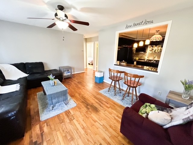 203 Glenhaven Road Paris, TN 38242 - Photo 2 of 42 a living room with furniture and a flat screen tv