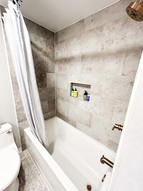 203 Glenhaven Road Paris, TN 38242 - Photo 23 of 42 a bathroom with a tub and a shower