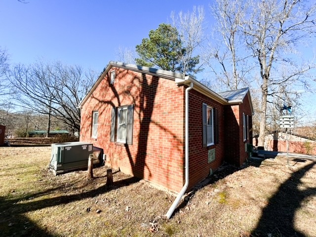 203 Glenhaven Road Paris, TN 38242 - Photo 37 of 42 a view of a backyard with wooden fence and large trees