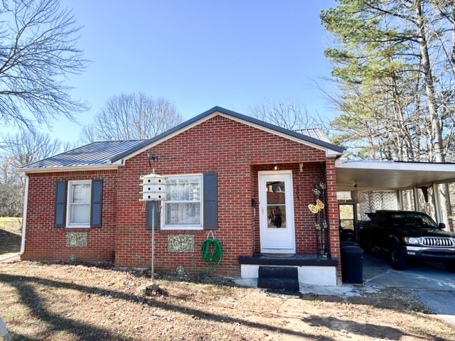 203 Glenhaven Road Paris, TN 38242 - Photo 40 of 42 a front view of a house with a yard